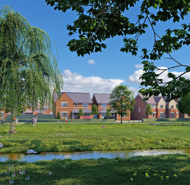 A large open space green area, with a stream and picnic benches near a row of houses.